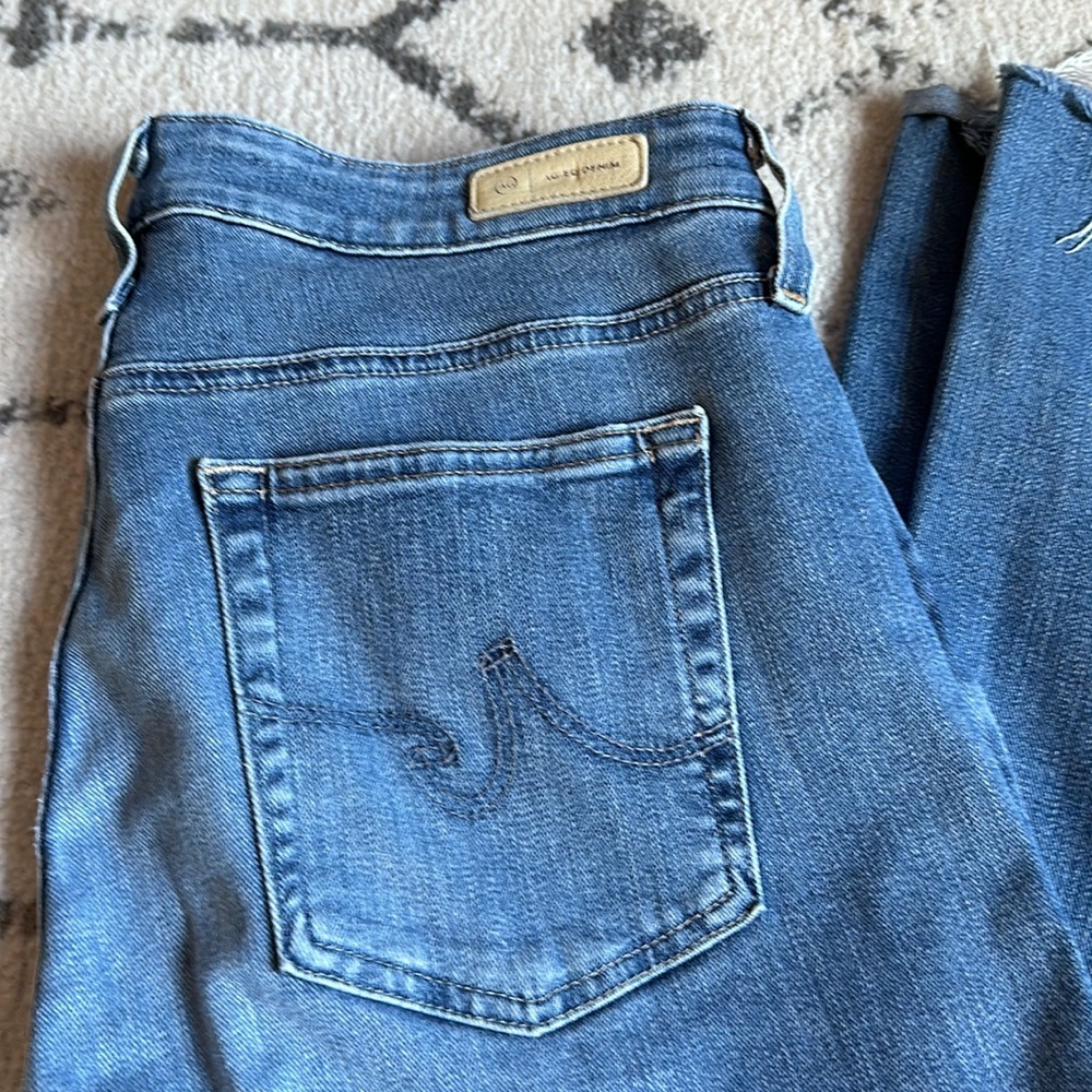 Light blue AG Farrah boot high rise, frayed hem jeans - size 32R